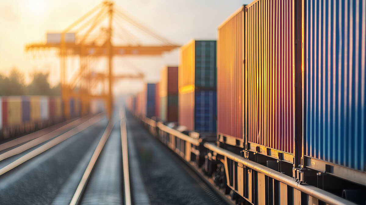 Close-up shot of a cargo train filled with colorful shipping containers in an industrial hub, with cranes loading and unloading, emphasizing the movement of goods for international Close-up shot of a cargo train filled with colorful shipping containers in an industrial hub, with cranes loading and unloading, emphasizing the...